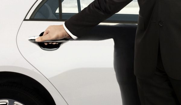 man holding car door